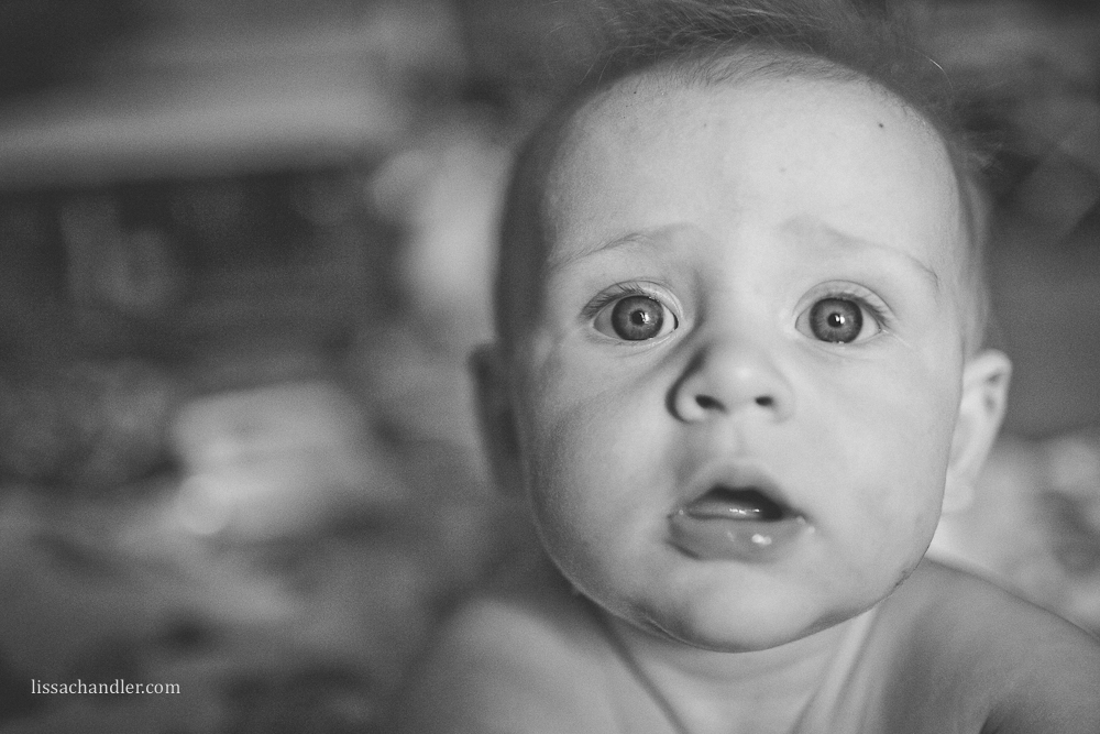 Photograph of baby boy staring at camera