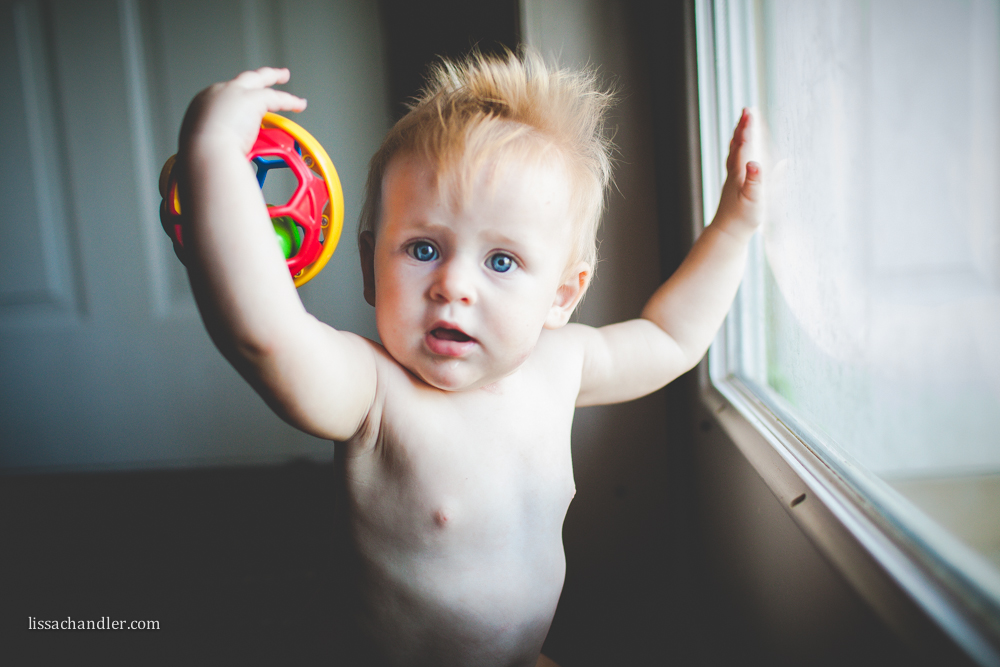 Baby Playing by a Window