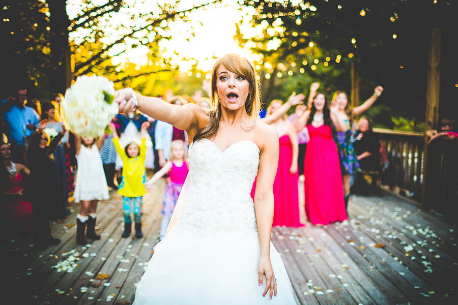 Bride throwing bouquet, Arkansas Wedding Photographer