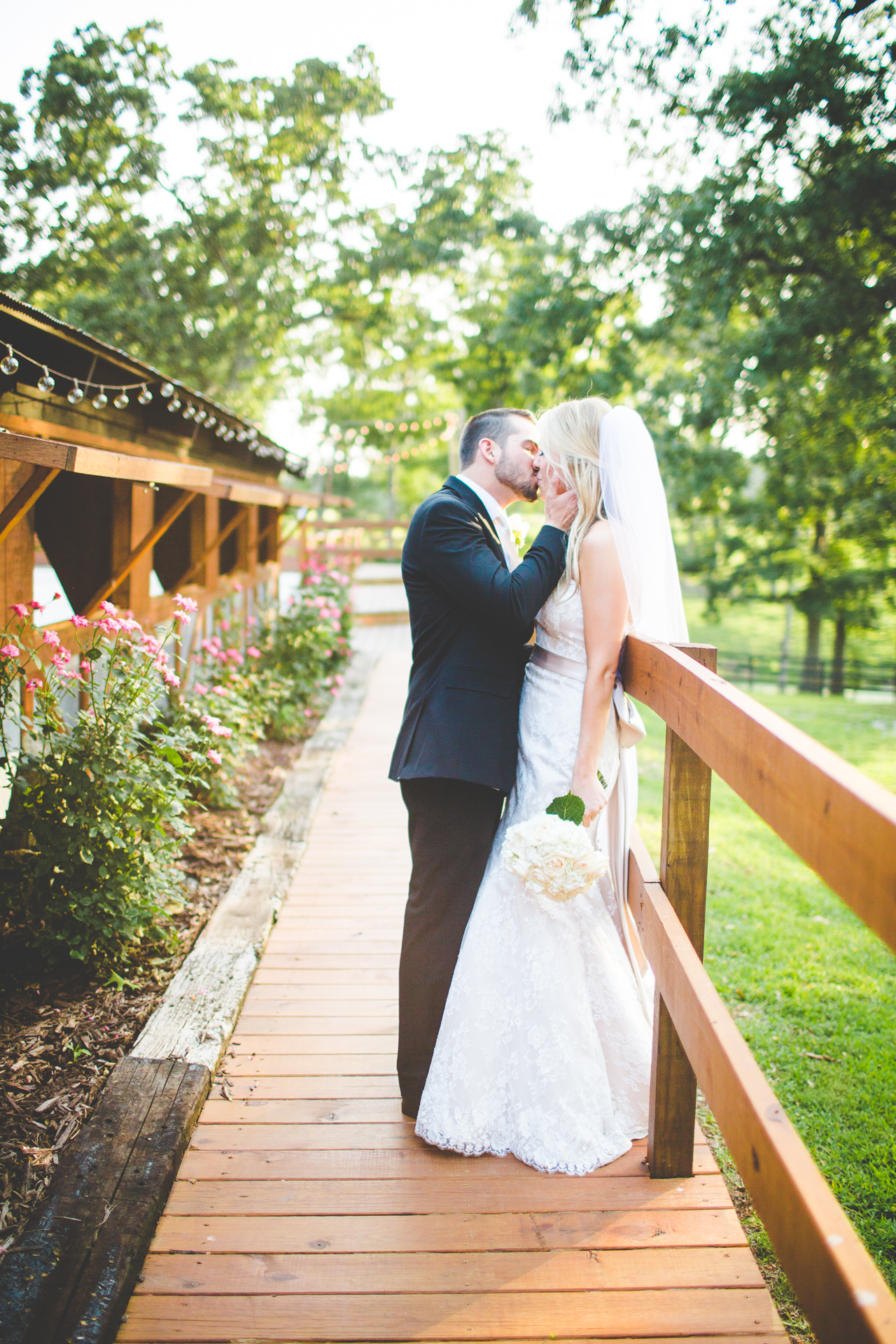 Lauren and JK - Wedding at the Barn at the Springs - NWA Wedding Photographer, lissachandler.com -5 Bride and Groom Kissing at The Barn at the Springs