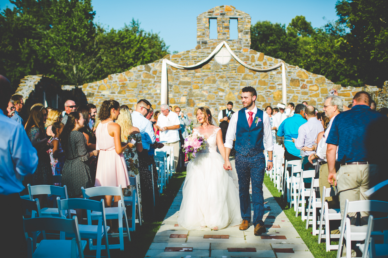 Bride and groom walk down the aisle at Sassafras Springs | Lissa Chandler Photography 