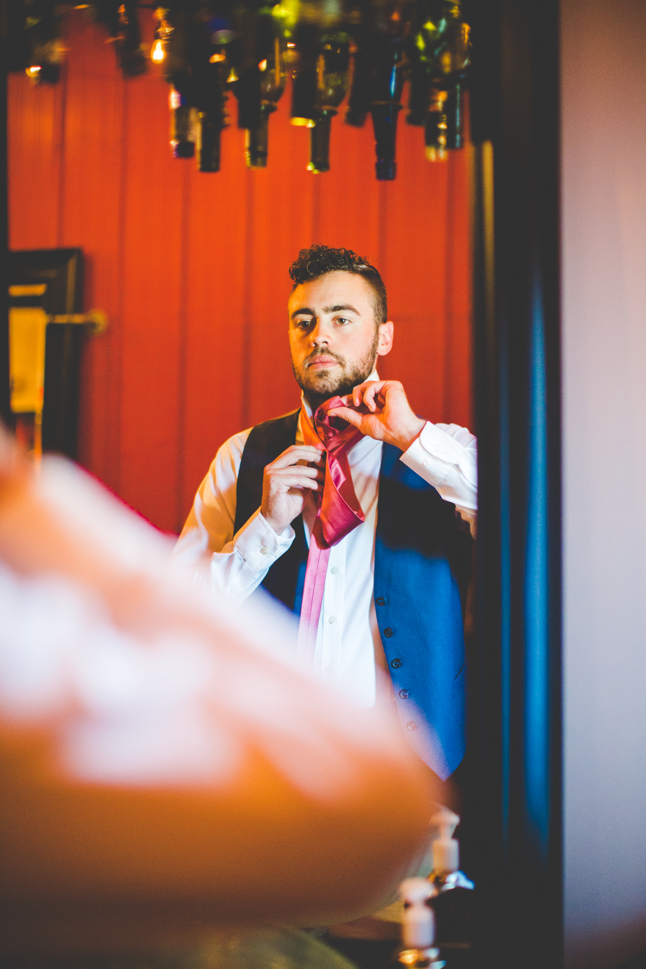 groom getting ready at sassafras springs in springdale arkansas, nwa summer wedding, arkansas wedding photographer 