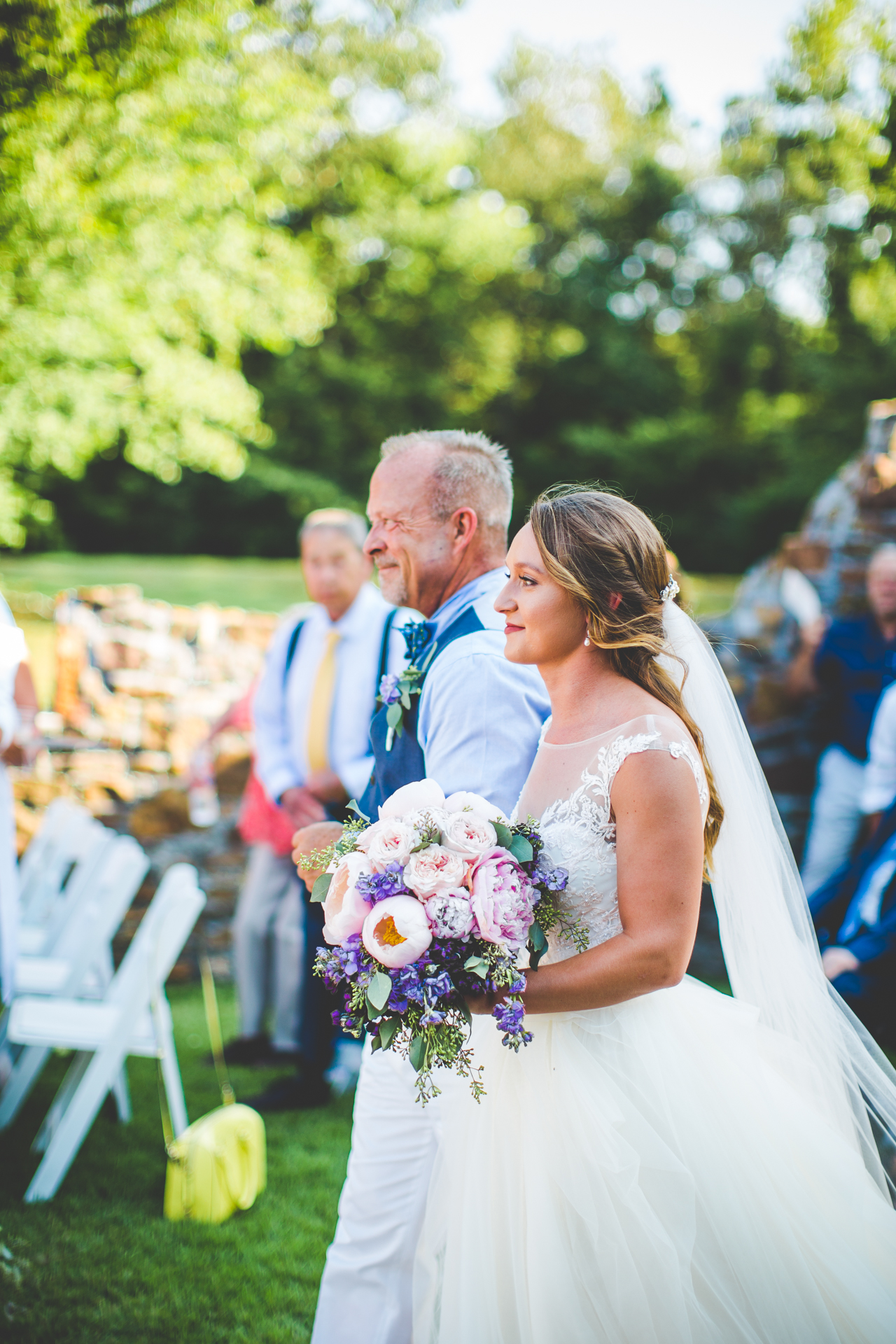 Bride walks down aisle at Sassafras Springs Vineyard