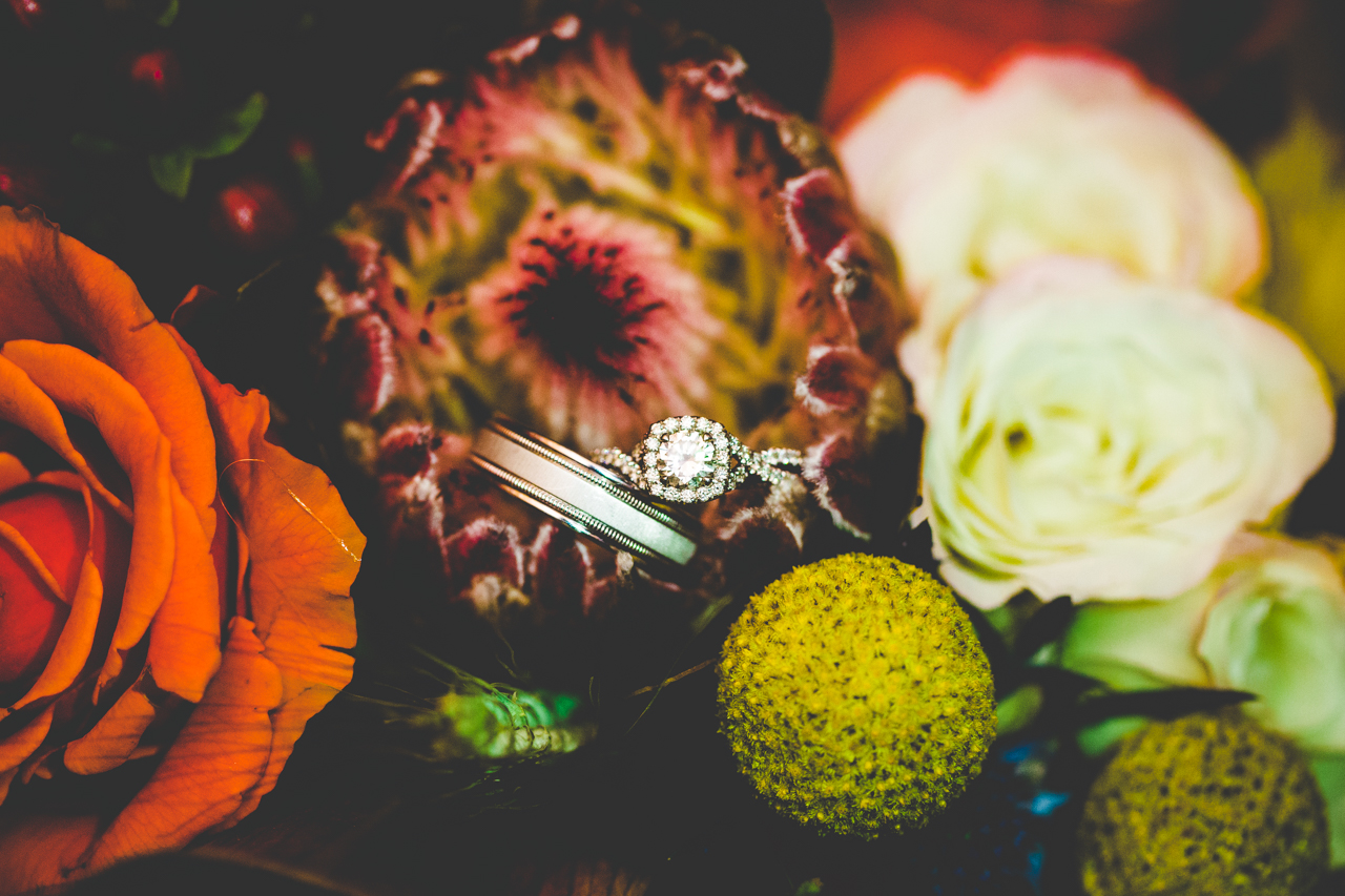 Fayetteville Arkansas Wedding Photographer, Fall Wedding at Pratt Place Barn, Carolyne and Adam-17 Photograph of Wedding Rings in wedding bouquet