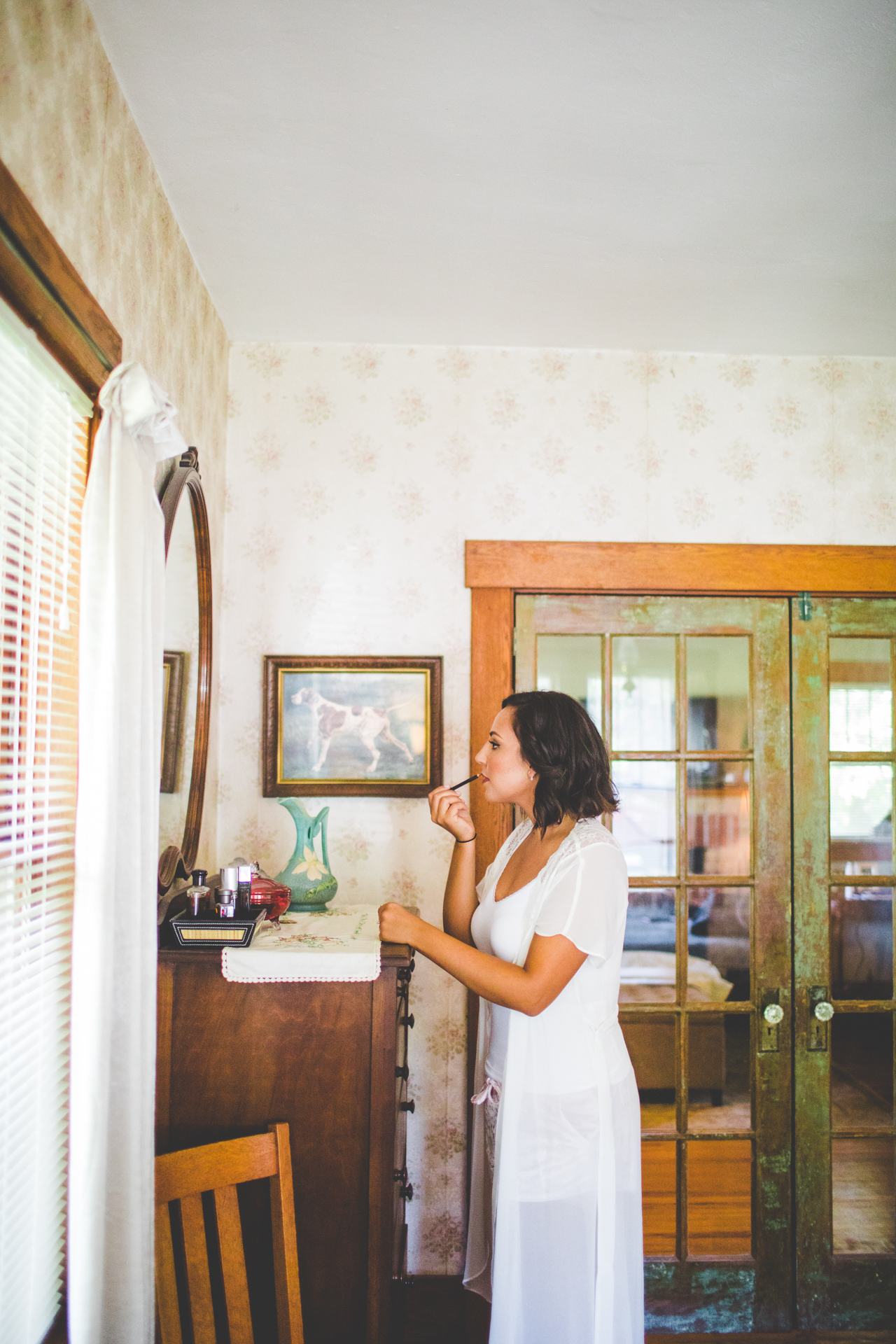 Bride gets ready in vintage room
