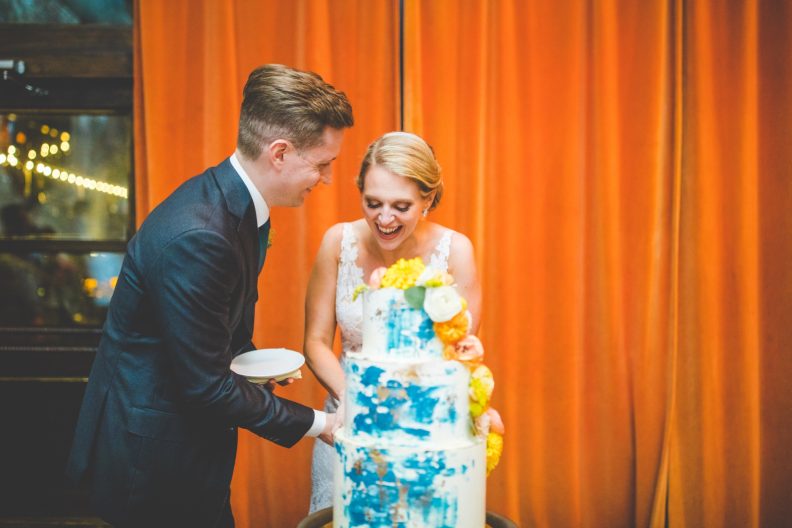 bride laughs during cake cutting, brooklyn wedding at my moon NYC