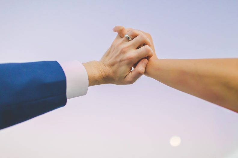Colorful Wedding Photography in Arkansas, Bride and Groom Holding Hands