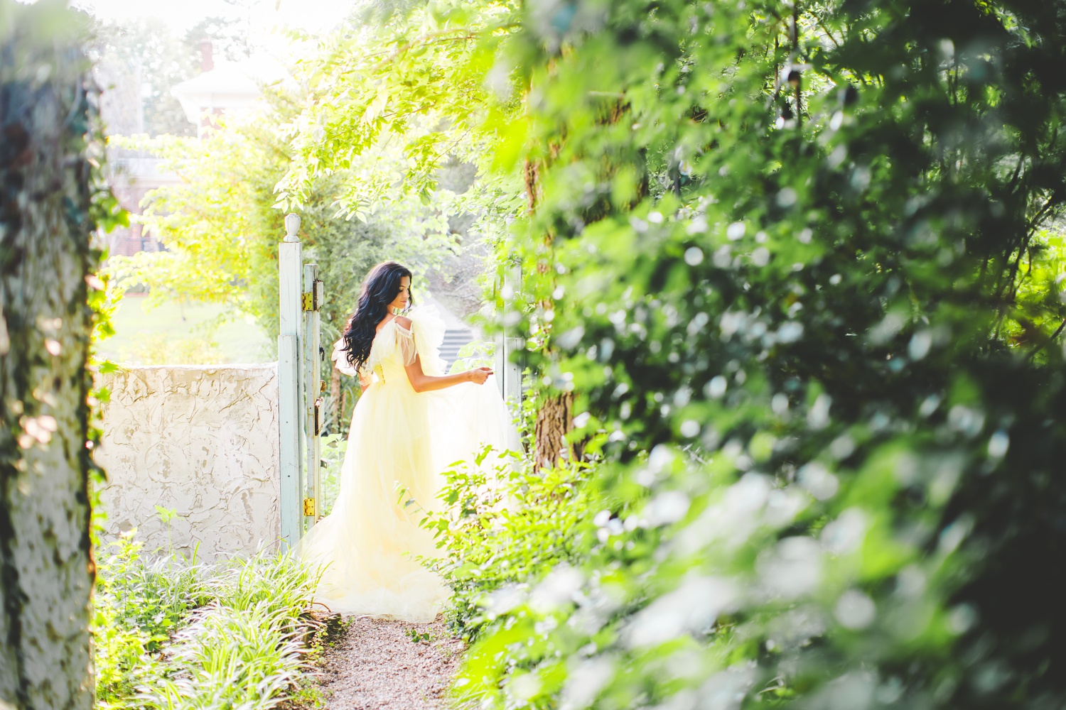 Colorful Wedding Photography in Tulsa: Bride in Garden Gate Wearing Yellow Dress