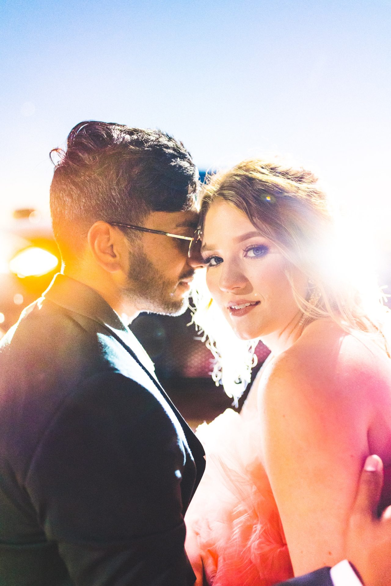 night time bride and groom photographs with colorful light by fayetteville wedding photographer 