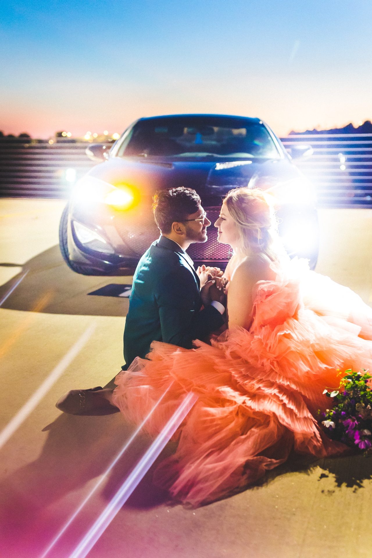 night time bride and groom photographs with colorful light by fayetteville wedding photographer 