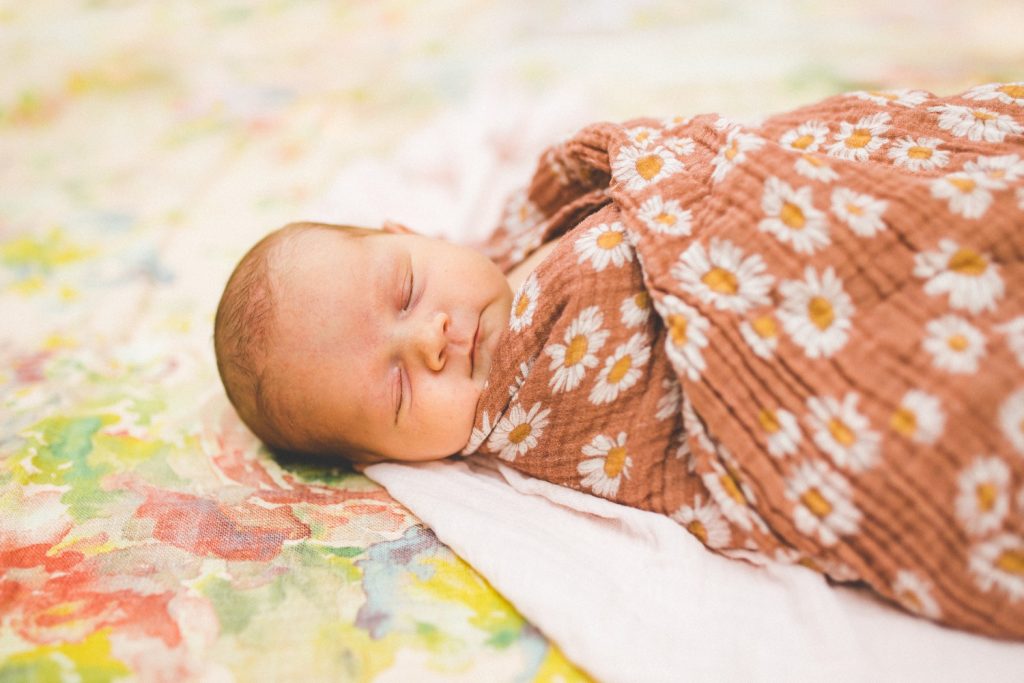 baby girl newborn photographs with floral blankets