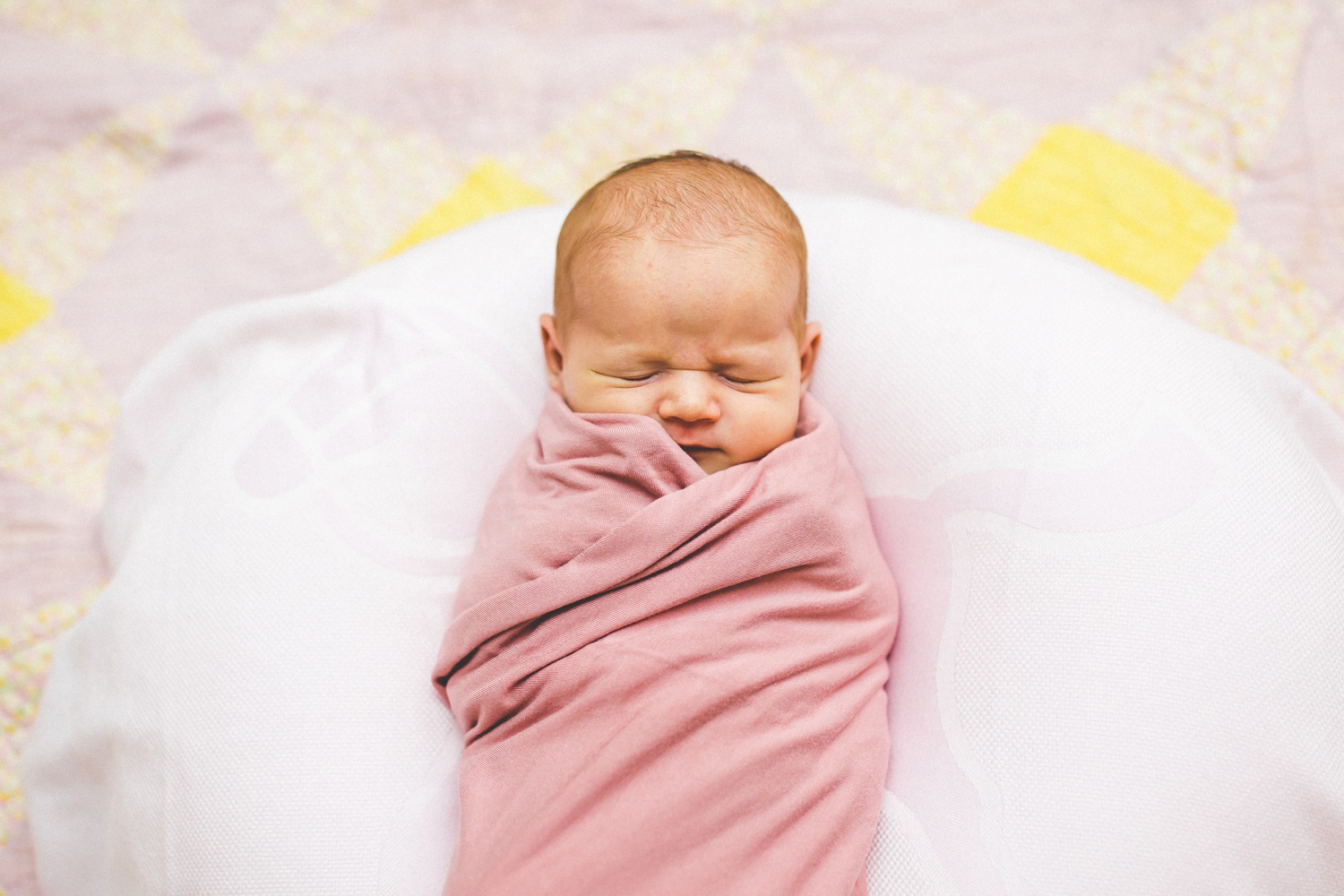 baby photos on vintage quilt in Northwest Arkansas 