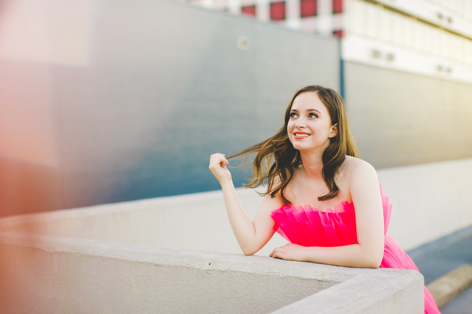 high school senior photographs with hot pink dress