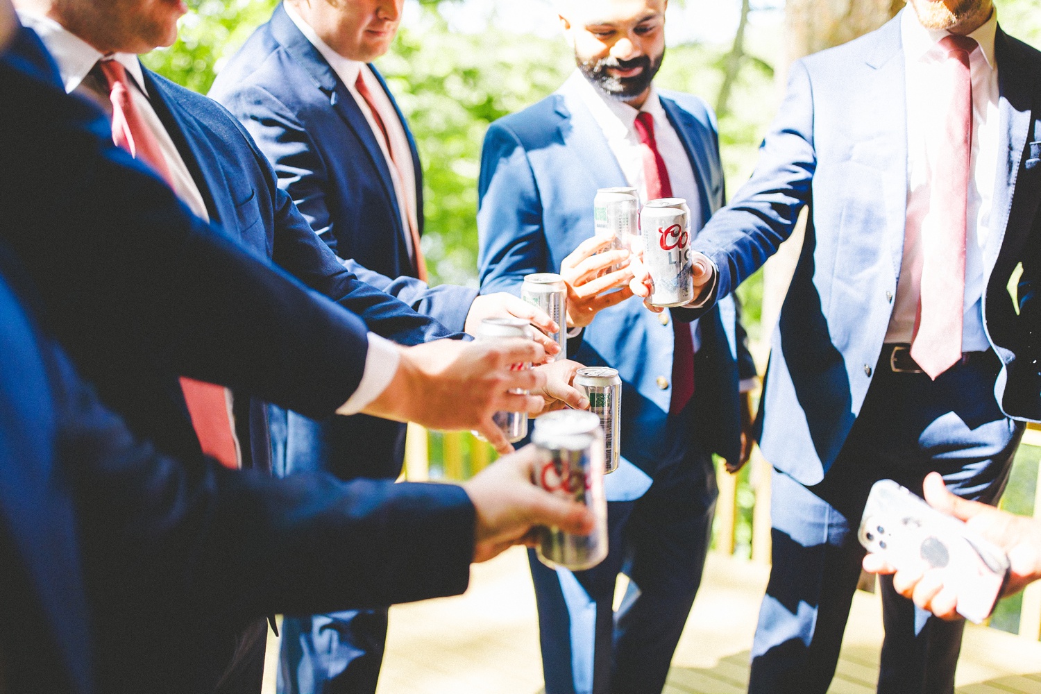 Grooms Cheering Beer Cans at Wedding in Bentonville Arkansas