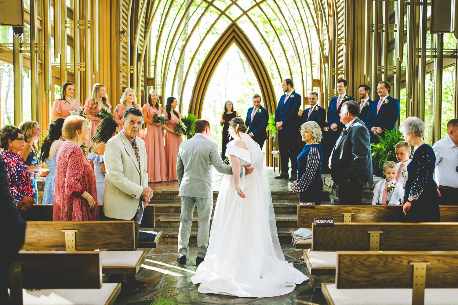 Bride Walks Down Aisle at Cooper Chapel Glass Chapel in Arkansas 