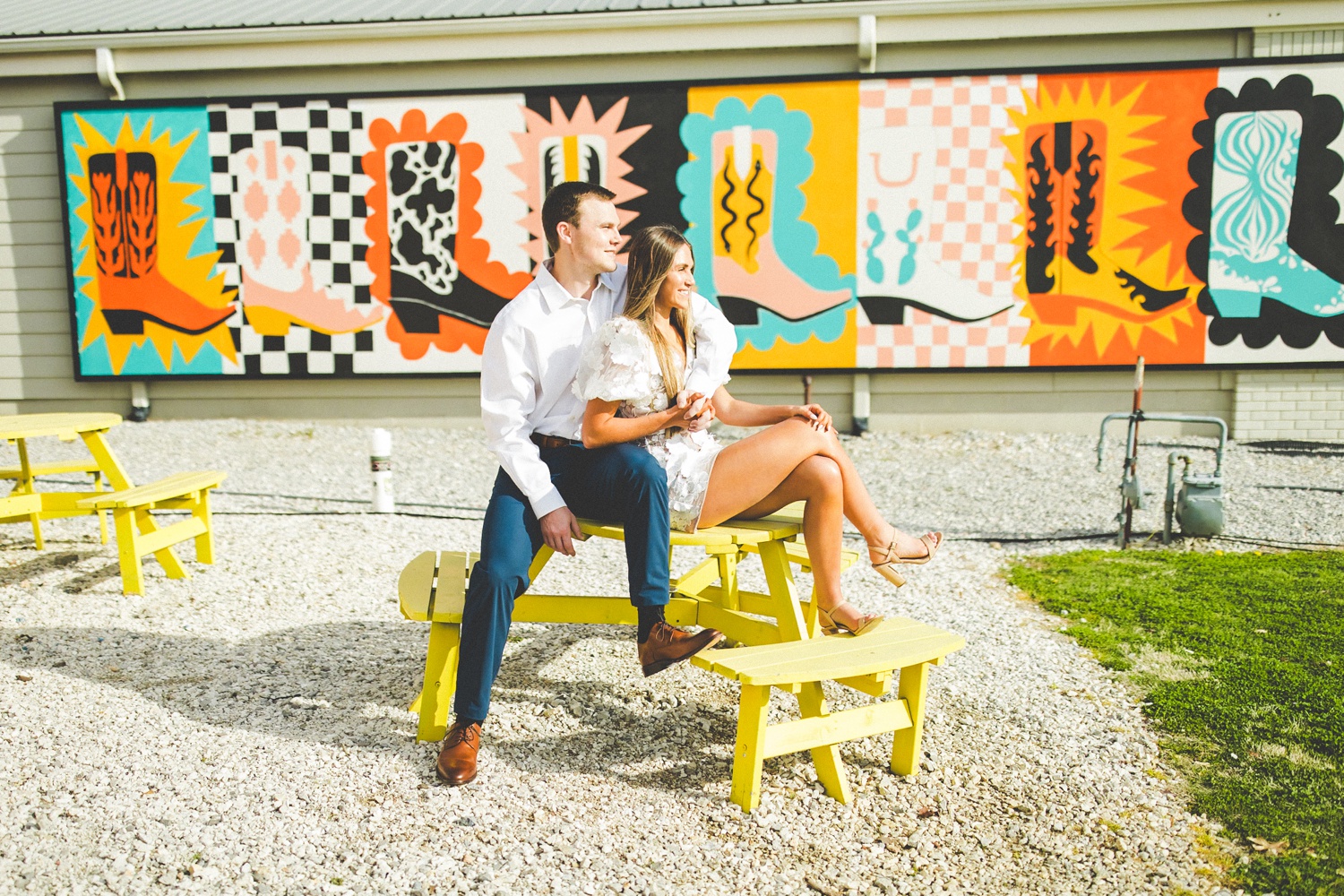 Cute Engagement Photographs in Front of Mural