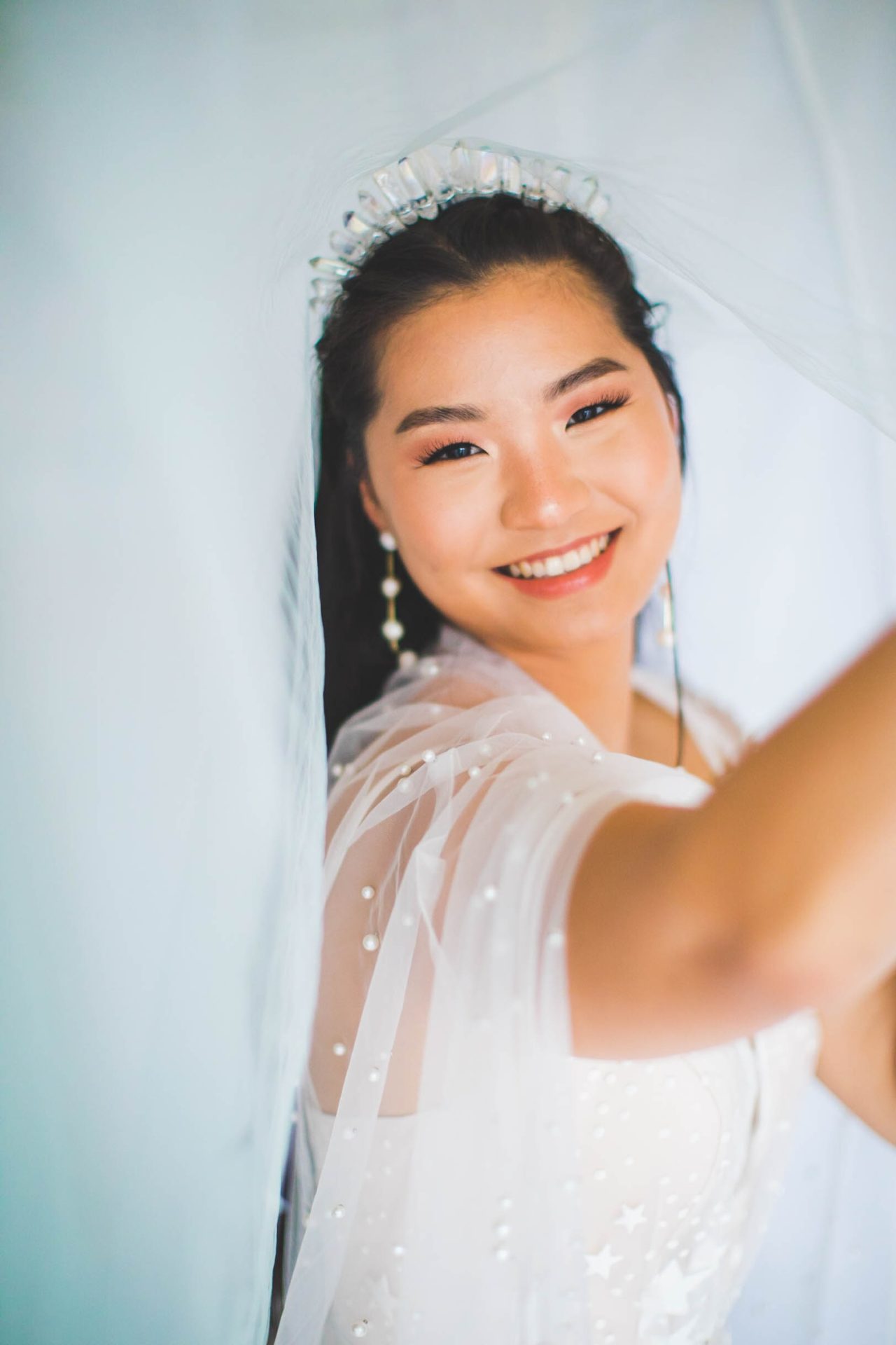 wedding dress with subtle star pattern and pearl cape