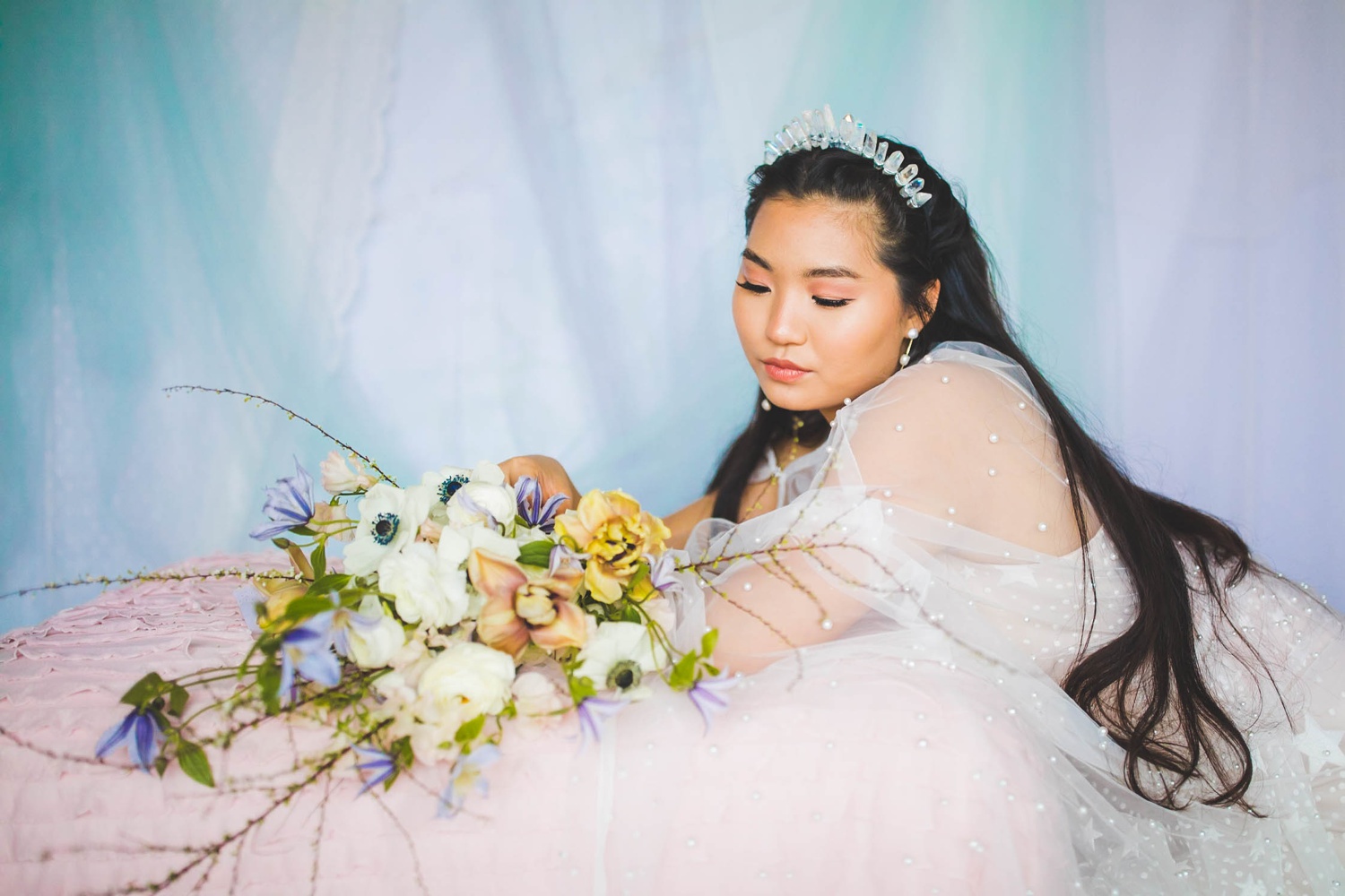 wedding dress with subtle star pattern and pearl cape