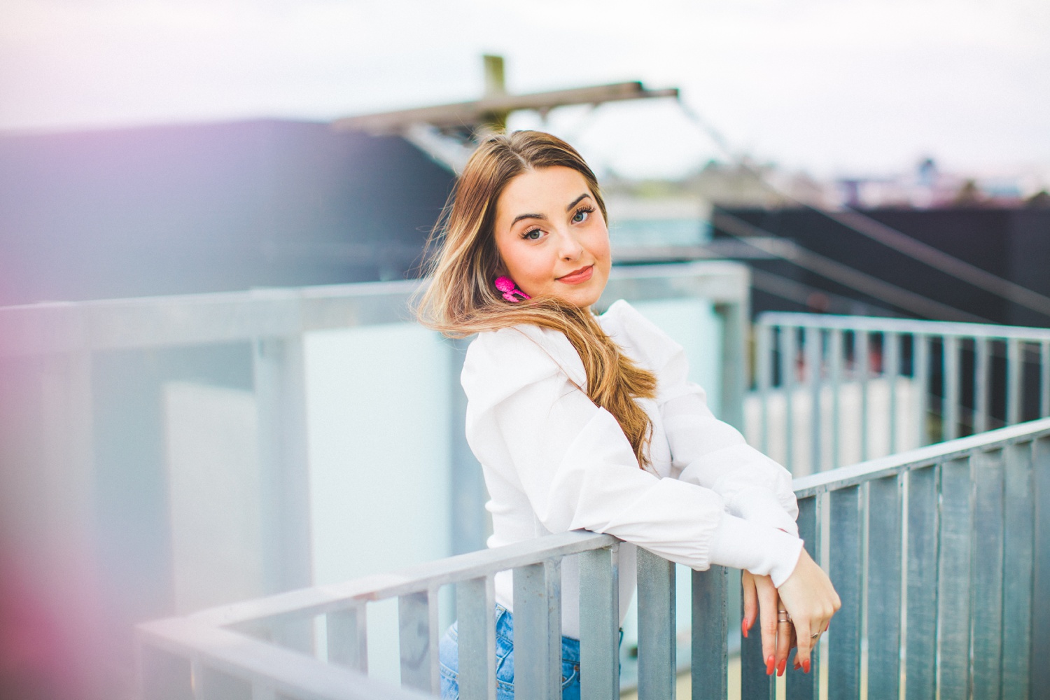 cute senior pictures in parking garage with 90s vibe