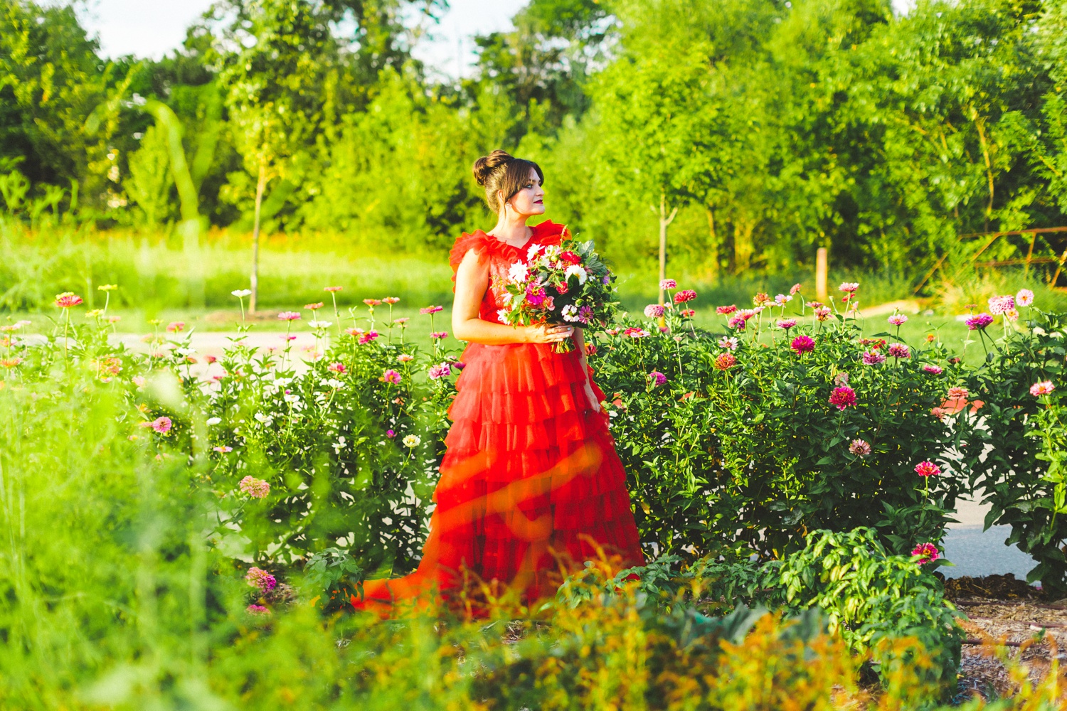 red wedding dress in garden wedding setting 
