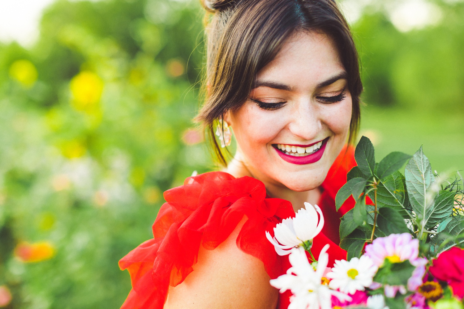 red wedding dress in garden wedding setting 