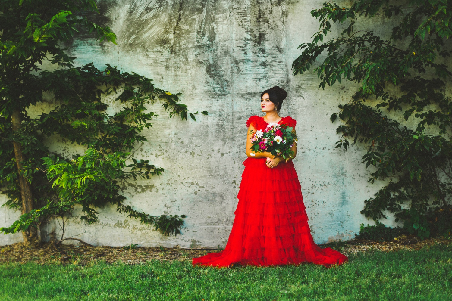 red wedding dress in garden wedding setting 
